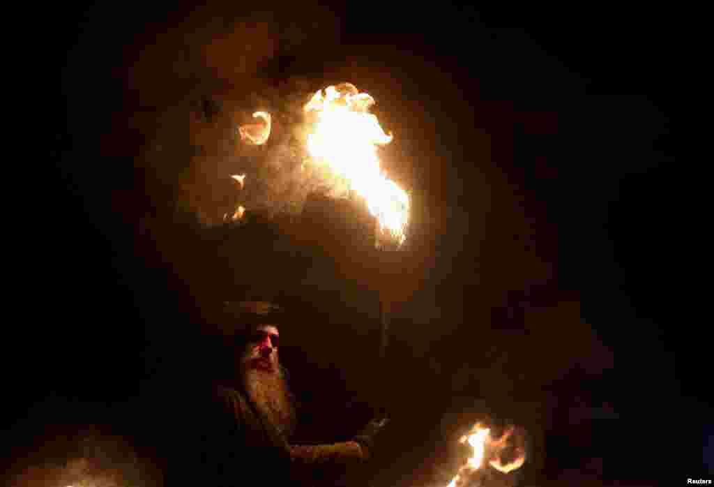 A member of the Beltane Fire Society takes part in the Samhuinn Fire Festival at Holyrood Park in Edinburgh, Scotland, Britain, Oct. 31, 2022.