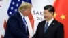 资料照：美国时任总统特朗普与中国领导人习近平2019年6月在大阪举行的G20峰会上握手。
