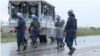FILE - Police monitor the situation during three-day protests in Harare, Zimbabwe, January 2019. 