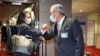 In this photo released by the Taiwan Ministry of Foreign Affairs, Taiwan Deputy Minister of Foreign Affairs Tien Chung-kwang, right, bumps elbow with US Rep. Stephanie Murphy at Taoyuan airport near Taipei, Sep. 7, 2022. 