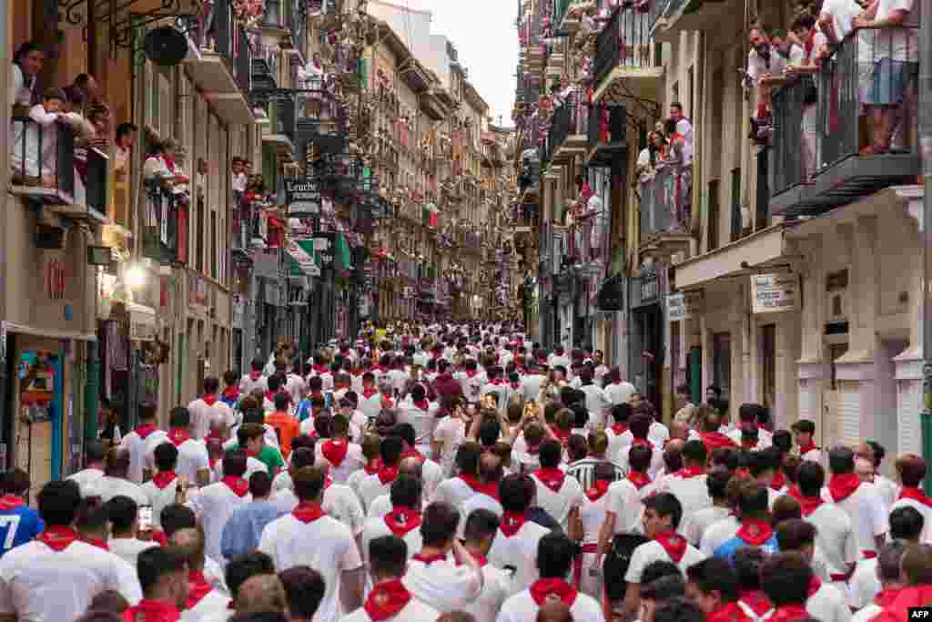 Participants prepare to run during the "encierro" (bull-run) of the San Fermin festival in Pamplona, northern Spain.