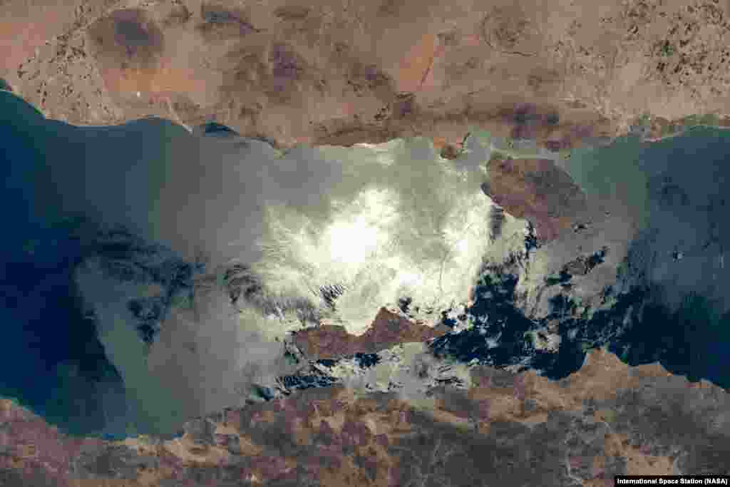 The sun's glint beams off the Gulf of California contrasting Mexico's coastal states of Baja California (bottom) and Sonora (top). The International Space Station was orbiting 261 miles above Sonora at the time of this photograph taken on May 26, 2024.