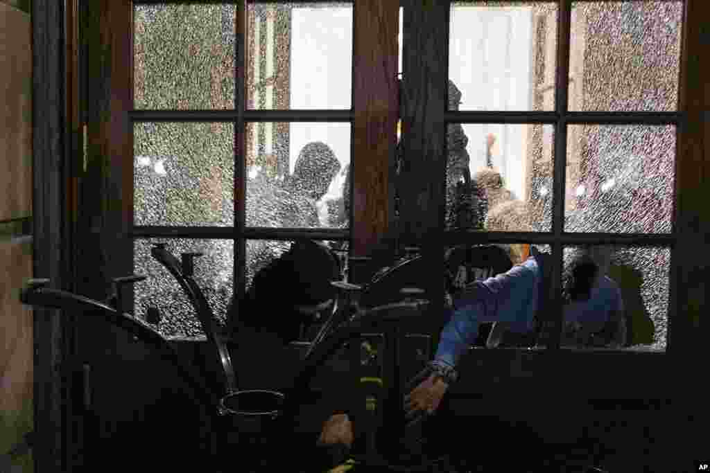 Students with the Gaza Solidarity Encampment block the entrance of Hamilton Hall at Columbia University after taking it over in New York.