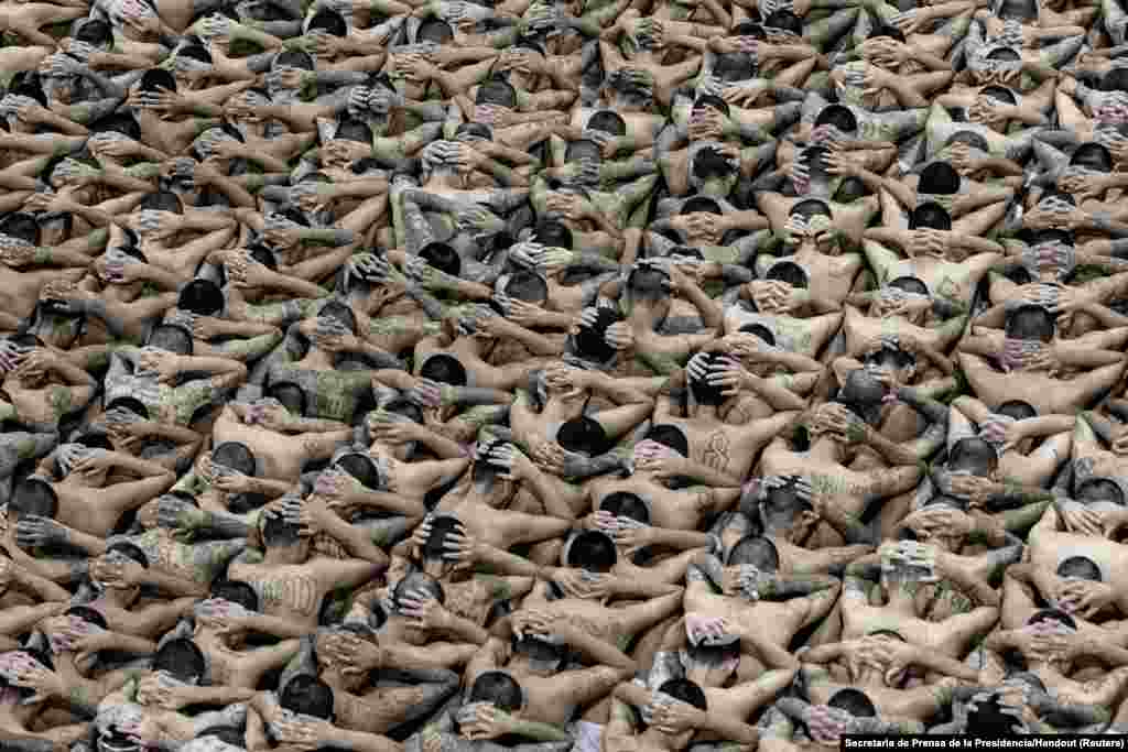 Gang members wait in their cells upon their arrival at the Terrorism Confinement Center, as part of a move announced by El Salvador&#39;s President Nayib Bukele on social media, in Tecoluca, June 11, 2024.