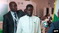 Senegal President Bassirou Diomaye Faye leaves the Banquet Hall after the closing session of the ordinary session of Economic Community of West African States (ECOWAS) Heads of State and Government in Abuja, Nigeria, July 7, 2024. 