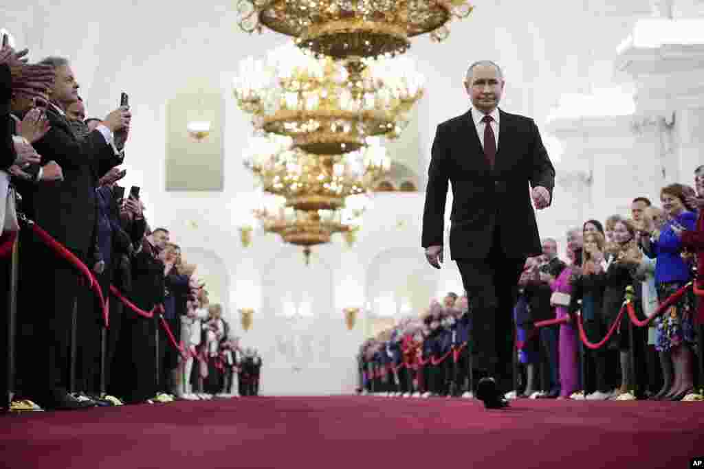 Vladimir Putin walks to take his oath as Russian president during an inauguration ceremony in the Grand Kremlin Palace in Moscow.
