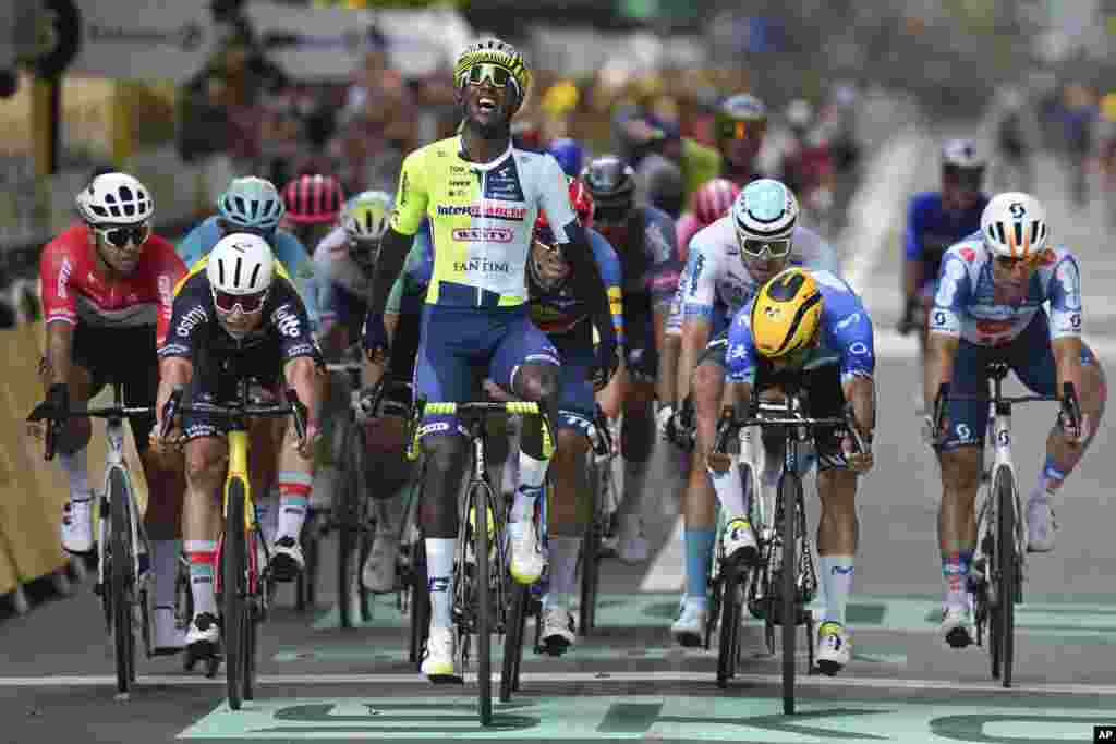 Eritrea's Biniam Girmay celebrates as he crosses the finish line during the third stage of the Tour de France cycling race over 230.8 kilometers (143.4 miles) with start in Piacenza and finish in Turin, Italy.