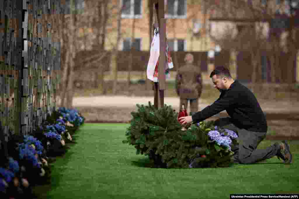Ukraine&#39;s President Volodymyr Zelensky honors the memory of the victims of the Russian occupation at a memorial in the town of Bucha.