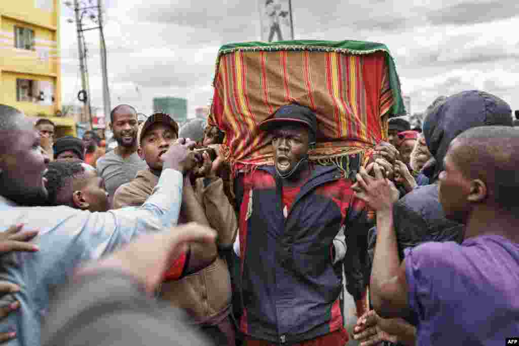Family, friends and fellow protesters carry the body of Ibrahim Kamau, 19, in a procession as they chant slogans to show their respects in the streets of Nairobi. Kamau was killed at the Kenyan Parliament during the nationwide protest against a controversial now-withdrawn tax bill that left over 20 dead and shocked the East African nation.