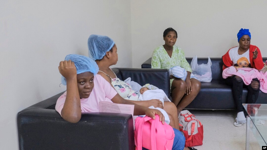FILE - Women who recently gave birth wait for medical attention at the Nuestra Señora de la Altagracia Maternity Hospital in Santo Domingo, Dominican Republic, Dec. 10, 2023. 