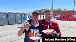 A life in community: Venezuelan migrants sleeping on the streets of El Paso show a plate of food donated by organizations.
