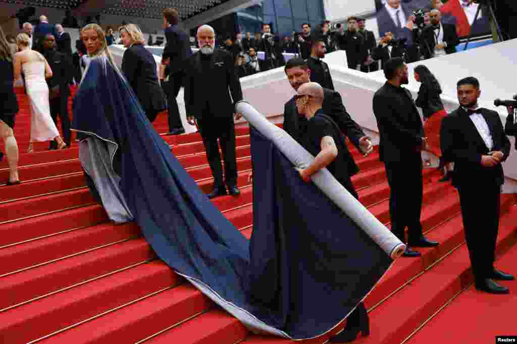 Bilal Hassani poses on the red carpet during arrivals for the screening of the film "The Apprentice" in competition at the 77th Cannes Film Festival in Cannes, France.