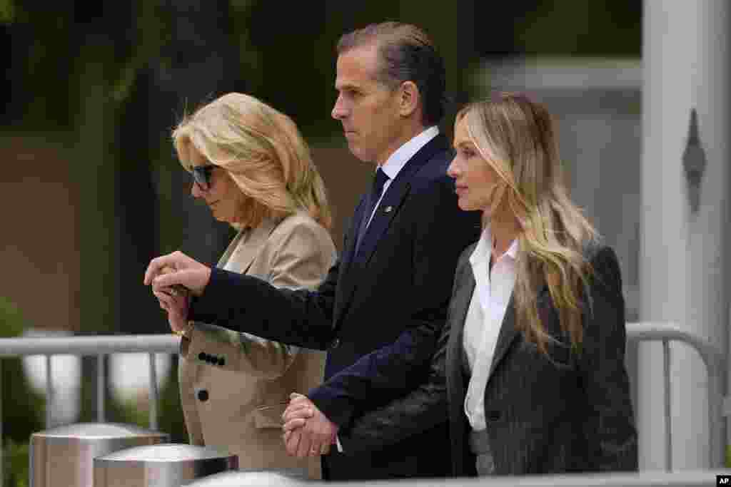 Hunter Biden, center, accompanied by his mother, first lady Jill Biden, left, and his wife, Melissa Cohen Biden, walks out of federal court after being convicted of all 3 felony charges in the federal gun trial, in Wilmington, Delaware.