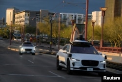 In this file photo, two Waymo autonomous vehicles drive themselves down Central Avenue in Phoenix, Arizona, U.S., March 18, 2024. (REUTERS/Caitlin O'Hara)