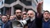 Protest leader Archbishop Bagrat Galstanyan speaks at a rally opposing a land transfer to Azerbaijan, in Yerevan, May 15, 2024. Armenia has returned to Azerbaijan four border villages it seized decades ago, the countries confirmed May 24, 2024.