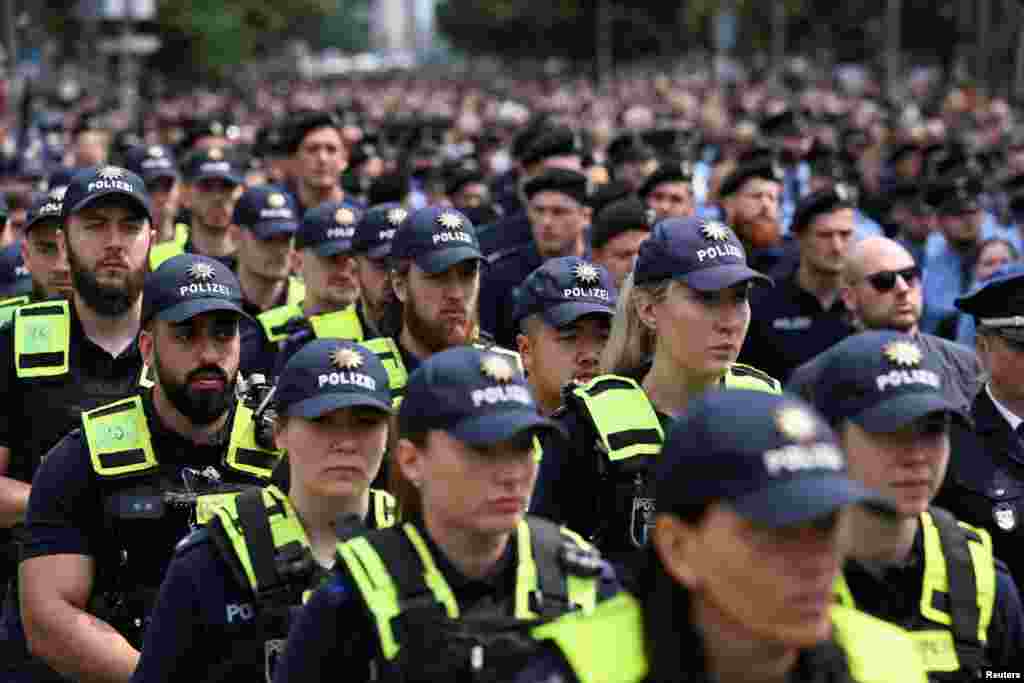 Police officers attend a mourning march for the 29-year-old police officer Rouven L., who died following a knife attack in Mannheim, in Berlin, Germany.