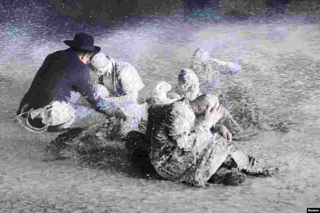 Security forces use water canon to disperse Ultra-Orthodox Jewish men protesting against army recruitment in the Mea Shearim neighborhood of Jerusalem, June 30, 2024. The Supreme Court's ruling required the state to begin drafting ultra-Orthodox Jewish seminary students to the military.