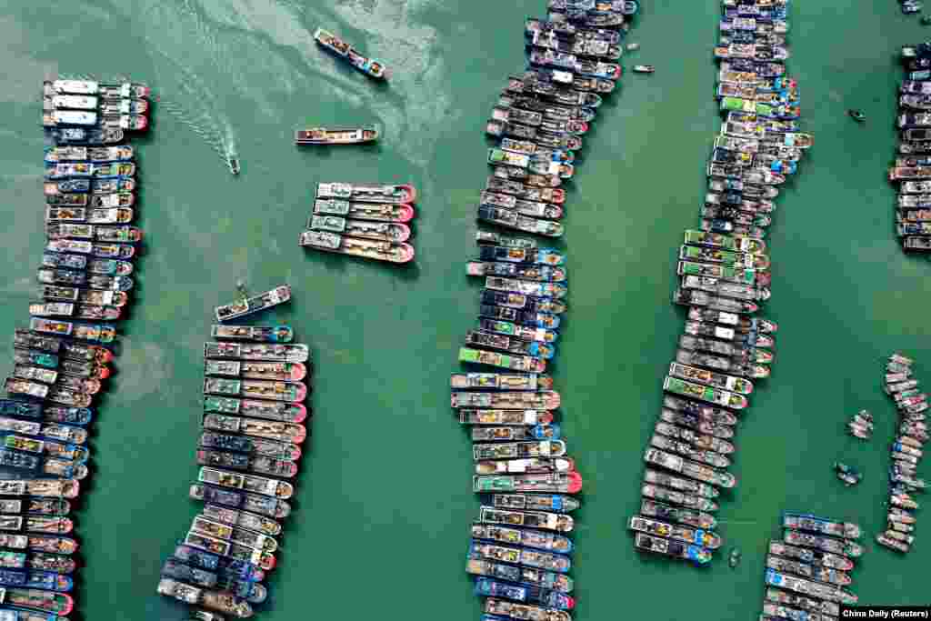 A drone view shows fishing boats being moored at a port as Typhoon Gaemi approaches, in Lianjiang county of Fuzhou, Fujian province, China, July 23, 2024.
