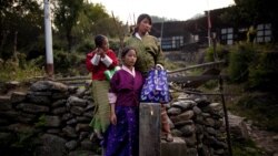 China holds the 65th–anniversary celebration of its Tibet takeover in new villages along Indian and Bhutan borders. 