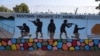 FILE - A mural urging people to stay vigilant and mobilized is seen in Ouagadougou, Burkina Faso, March 1, 2023. Burkina Faso has frozen the assets of 113 individuals and two groups over the "financing of terrorism," according to a decree released Nov. 21, 2024. 