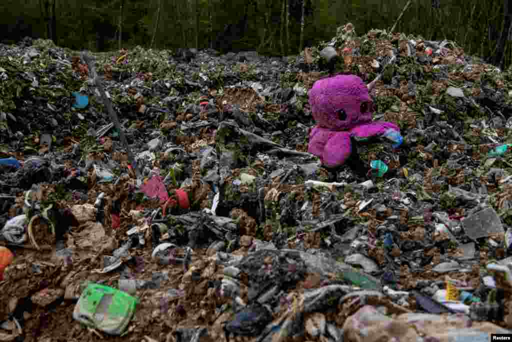 Illegally dumped commercial waste covers Hoad's Wood, a 199-acre site of protected ancient woodland that has seen industrial-scale illegal dumping reaching heights of 12 feet, in Ashford, Britain.