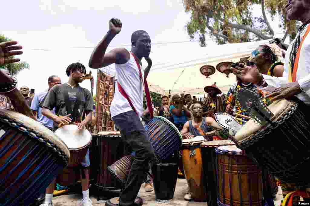 People attend a gathering to mark Juneteenth, which commemorates the end of slavery in Texas, over two years after the 1863 Emancipation Proclamation freed slaves elsewhere in the U.S., in Leimart Park, in Los Angeles, June 19, 2024.
