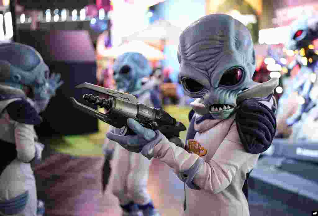 A fantasy figure promotes a video game at the Gamescom computer gaming fair in Cologne, Germany.