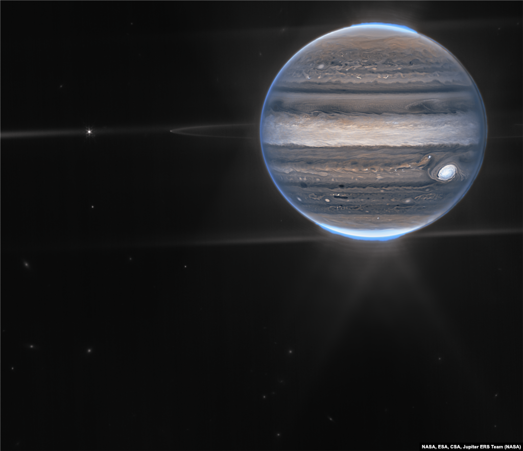 NASA’s James Webb Space Telescope captures new images of Jupiter showcasing auroras and hazes. Webb sees Jupiter with its faint rings, which are a million times fainter than the planet, and two tiny moons called Amalthea and Adrastea. (image processing by Ricardo Hueso (UPV/EHU) and Judy Schmidt)