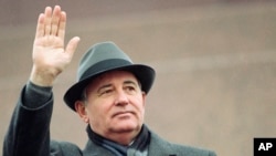 FILE - Soviet President Mikhail Gorbachev waves from the Red Square tribune during a Revolution Day celebration, in Moscow, Soviet Union, Nov. 7, 1989.