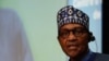 FILE - Nigeria's President Muhammadu Buhari speaks at the European Union-African Union summit in Brussels on Feb. 18, 2022. Following violent protests over a shortage of cash, Buhari extended until April 10, 2023, the deadline for older currency notes to remain legal tender.