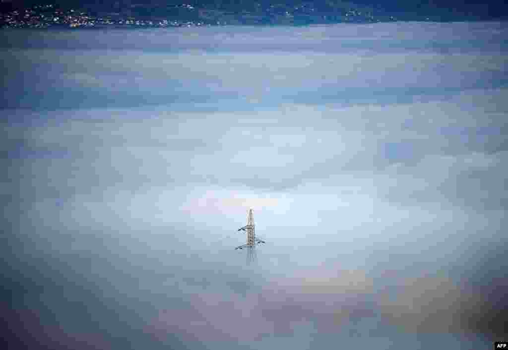 Skopje's valley is seen surrounded by fog in Skopje, North Macedonia.