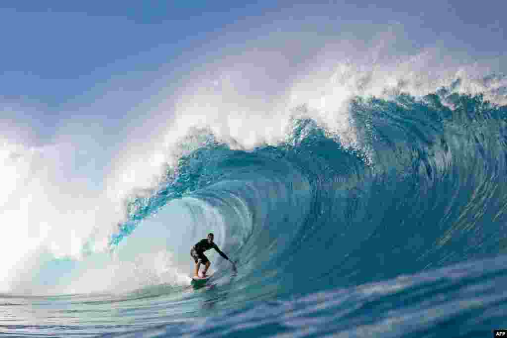 Surfer Balaram Stack rides a wave during the Da Hui Backdoor Shootout (in memory of Duke Kahanamoku) on the north shore of Oahu, Hawaii, Jan. 14, 2023.