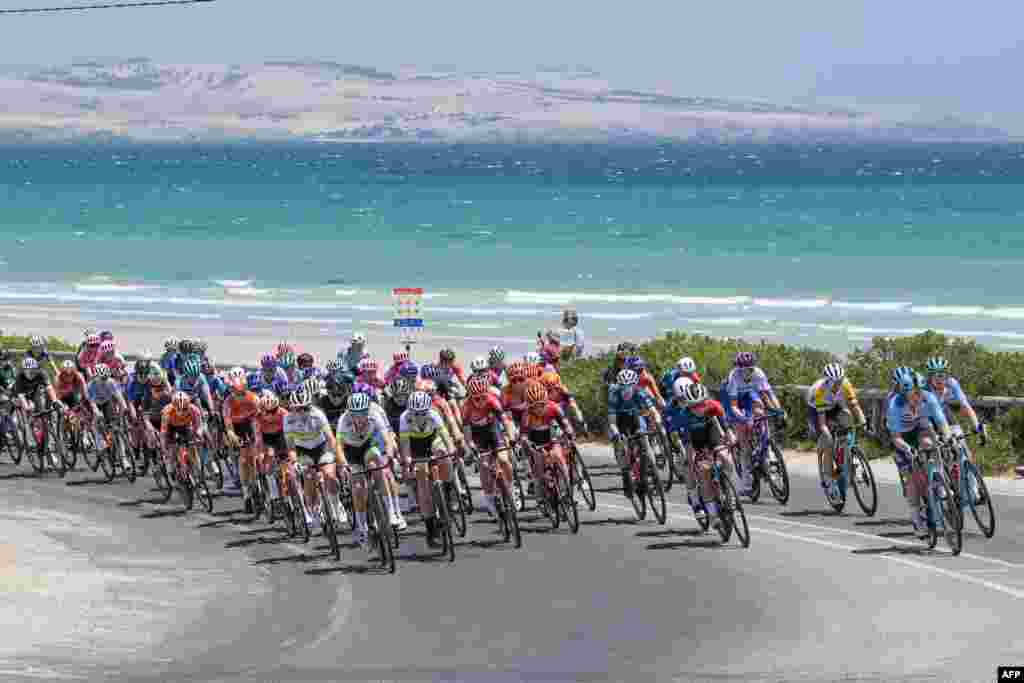 The peloton rides through the McLaren Vale wine district during stage one of the Women's Tour Down Under UCI cycling event in Adelaide, Australia.