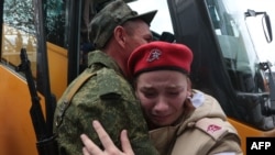Reservists drafted during the partial mobilization attend a departure ceremony in Sevastopol, in Russian-occupied Crimea, Sept. 27, 2022.