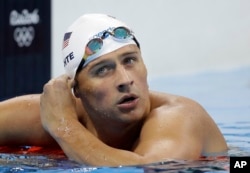 FILE - United States' Ryan Lochte checks his time in a men's 4x200-meter freestyle heat during the swimming competitions at the 2016 Summer Olympics, in Rio de Janeiro, Brazil, August 9, 2016.