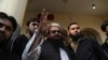 Hafiz Saeed, head of the Pakistan's Jamaat-ud-Dawa group waves to supporters at a mosque in Lahore, Pakistan, Nov. 24, 2017.