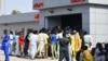FILE - People line up to withdraw new naira notes at an ATM in Maiduguri, Nigeria, on Jan. 29, 2023. 