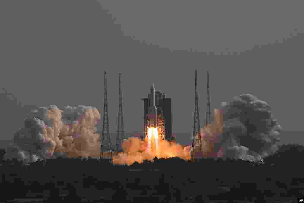 In this photo released by Xinhua News Agency, the Long March-5B Y4 carrier rocket carrying the space lab module Mengtian, blasts off from the Wenchang Satellite Launch Center in south China&#39;s Hainan Province. China has launched the third and final module to complete its permanent space station, realizing a more than decade-long endeavor to maintain a constant crewed presence in orbit.