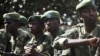 Congolese army soldiers sit in a military truck in Minova, 45 kilometers west of Goma, DRC, November 26, 2012. 
