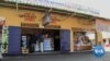 With Zimbabwe's economy struggling, more businesses are refusing to accept local currency, taking only U.S. dollars.