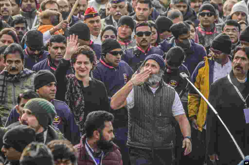 India's opposition Congress party leader Rahul Gandhi, center right and his sister and party leader Priyanka Vadra, center left, walk with their supporters during a "Unite India March," in Srinagar, Indian-controlled Kashmir.