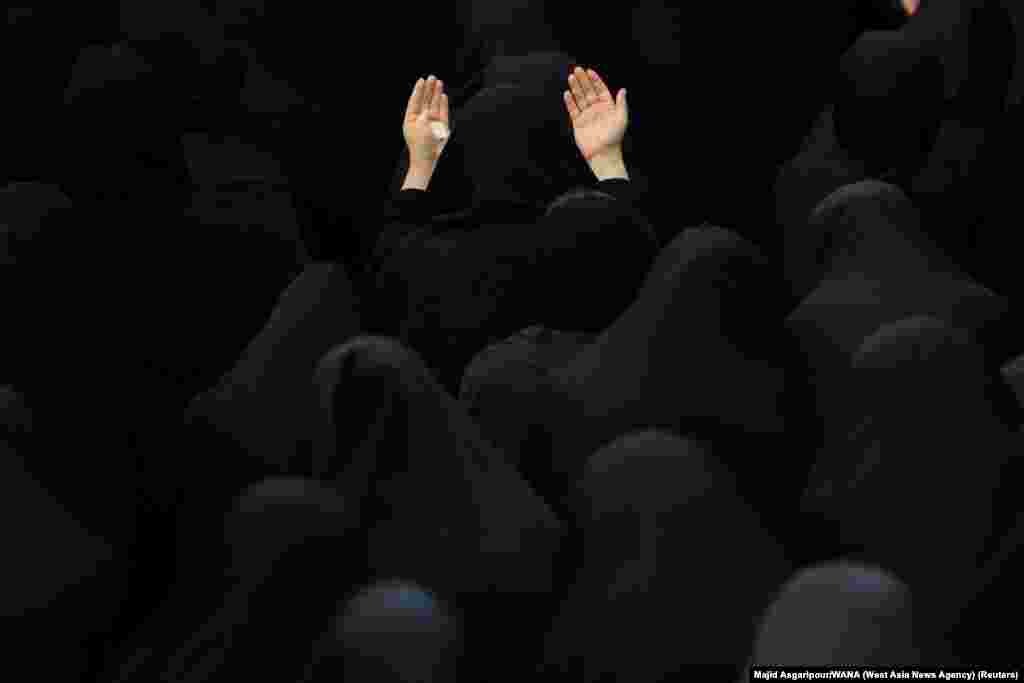 Iranian Shi'ite Muslim women take part in a mourning ritual ahead of Ashura, the holiest day on the Shi'ite Muslim calendar in Tehran, Aug. 7, 2022.