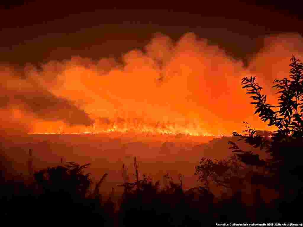 Trees and vegetation burn in a fire that ignited in the Monts d&#39;Arree in Brasparts, in Brittany, France, July 19, 2022.