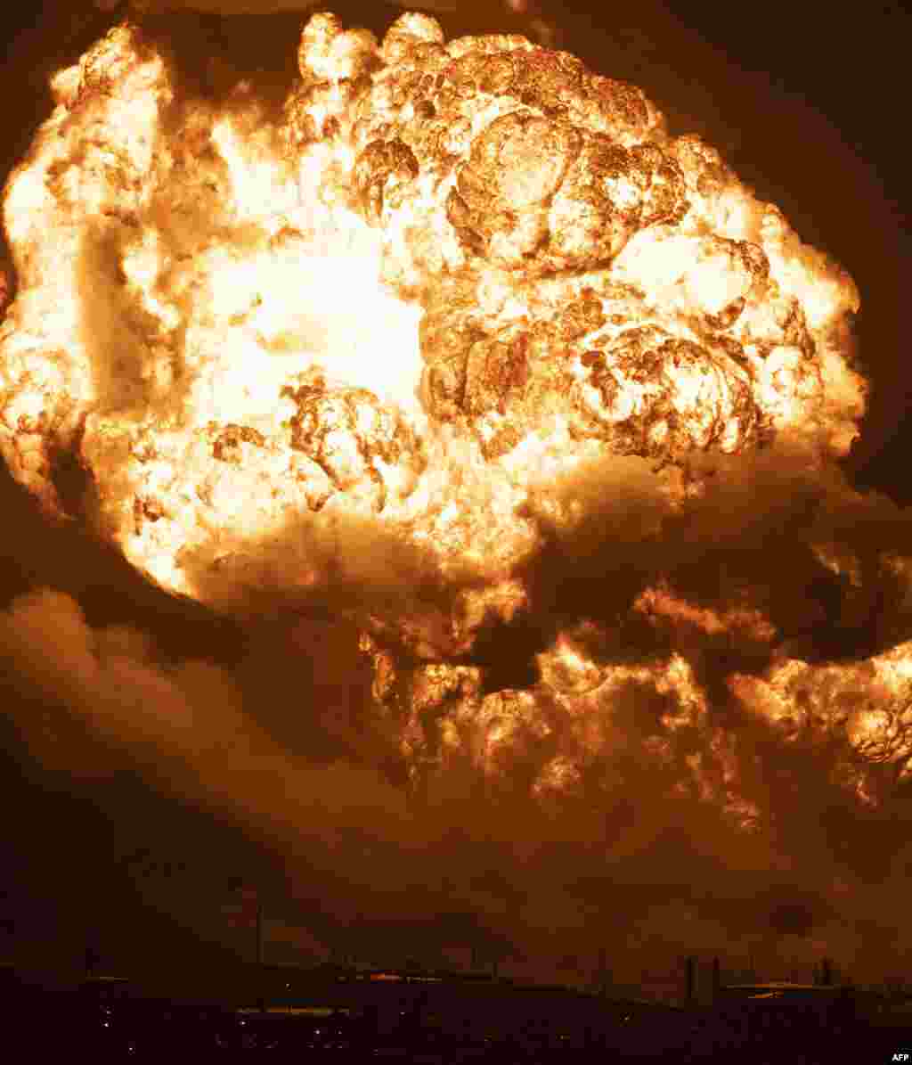 Flames rise from a massive fire at a fuel depot sparked by a lightning strike in Matanzas, Cuba.