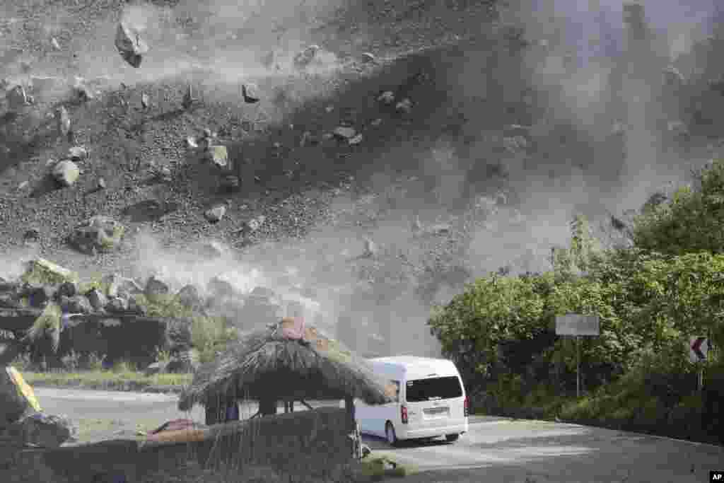 Boulders fall during an earthquake in Bauko, Mountain Province, Philippines. Scientists say the 7-magnitude quake was centered around Abra province in a mountainous area, killing at least four people and injuring dozens.