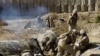 Marines of 2nd Battalion 2 Marines of 2nd Marine Expeditionary Brigade fire mortar rounds from their forward operating base in Mian Poshteh in Helmand Province, 23 Nov 2009