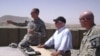 Secretary Gates receives a briefing from officers at Combat Outpost Senjaray, Afghanistan