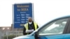 People queue in their cars at an NHS drive-through coronavirus disease (COVID-19) testing facility in the car park of Ikea in Wembley, as the spread of the coronavirus disease (COVID-19) continues, London, April 1, 2020.
