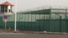 在中国西部新疆地区阿图什昆山工业园区，周围可以看到一座警卫塔和带刺铁丝网的一处设施。这是新疆地区越来越多的拘留营之一。