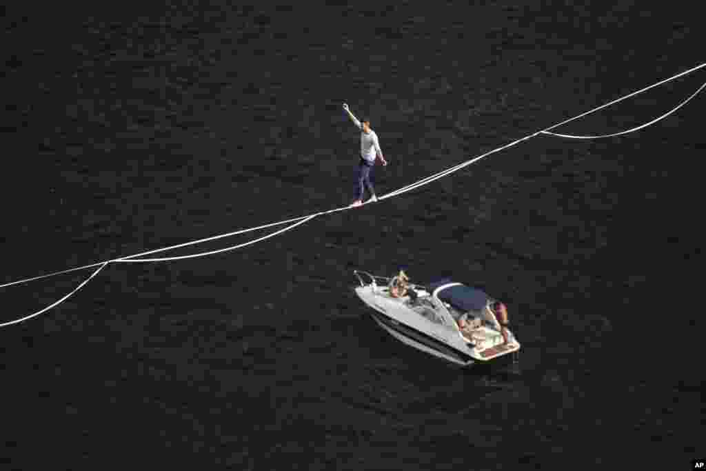 French slackliner Nathan Paulin crosses between Babilonia Morro and Urca, setting a local record in Rio de Janeiro, Brazil, Dec. 4, 2021.